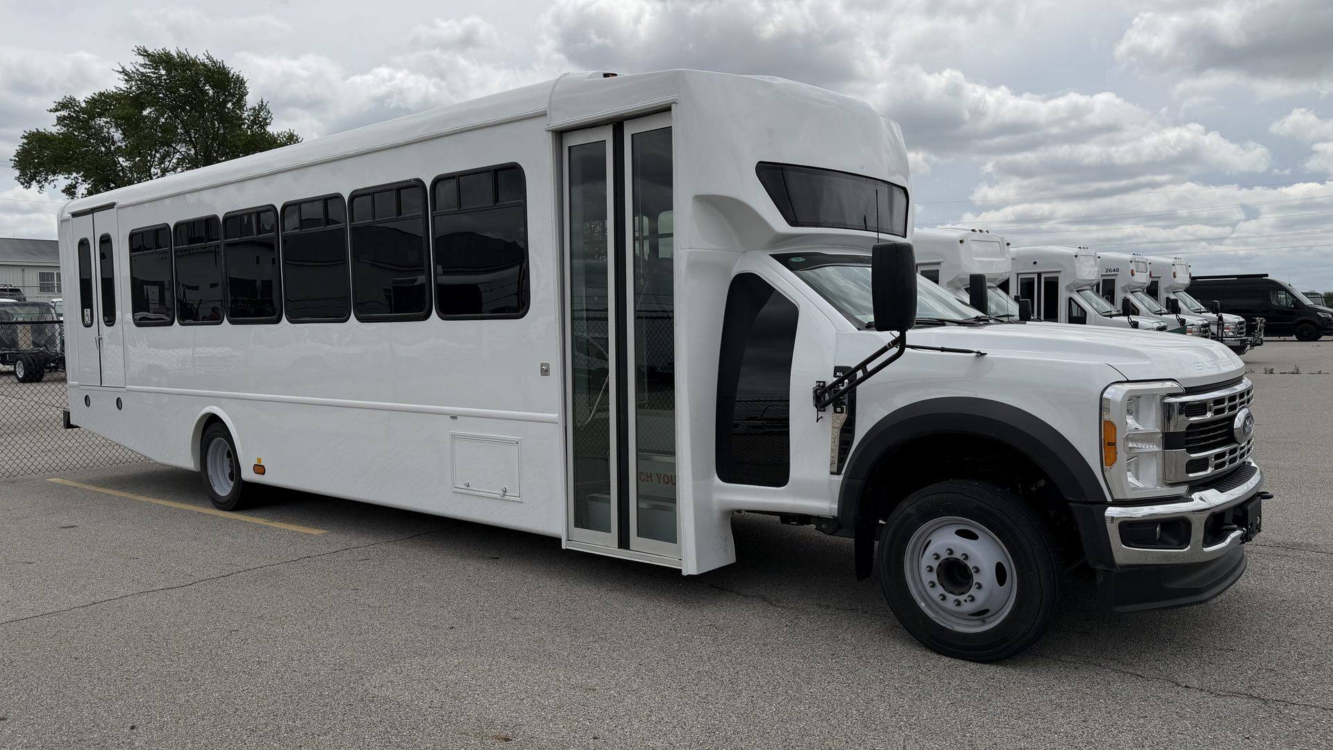 HLE Kavlyr shuttle bus on the Ford F-550 chassis, front three-quarter view outdoors